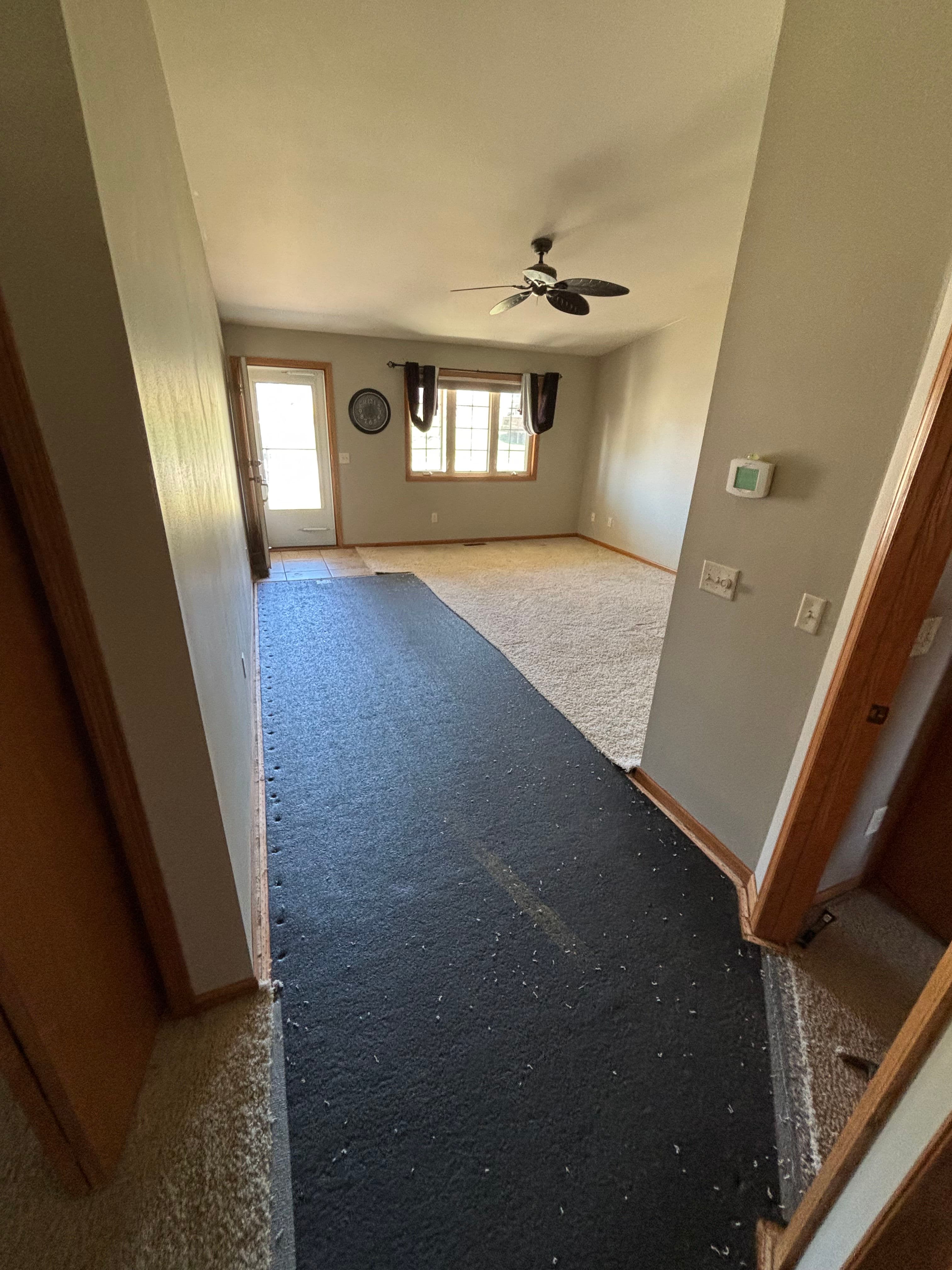 Project Carpet Removal and Luxury Vinyl Plank Installation for a Busy Family Home image