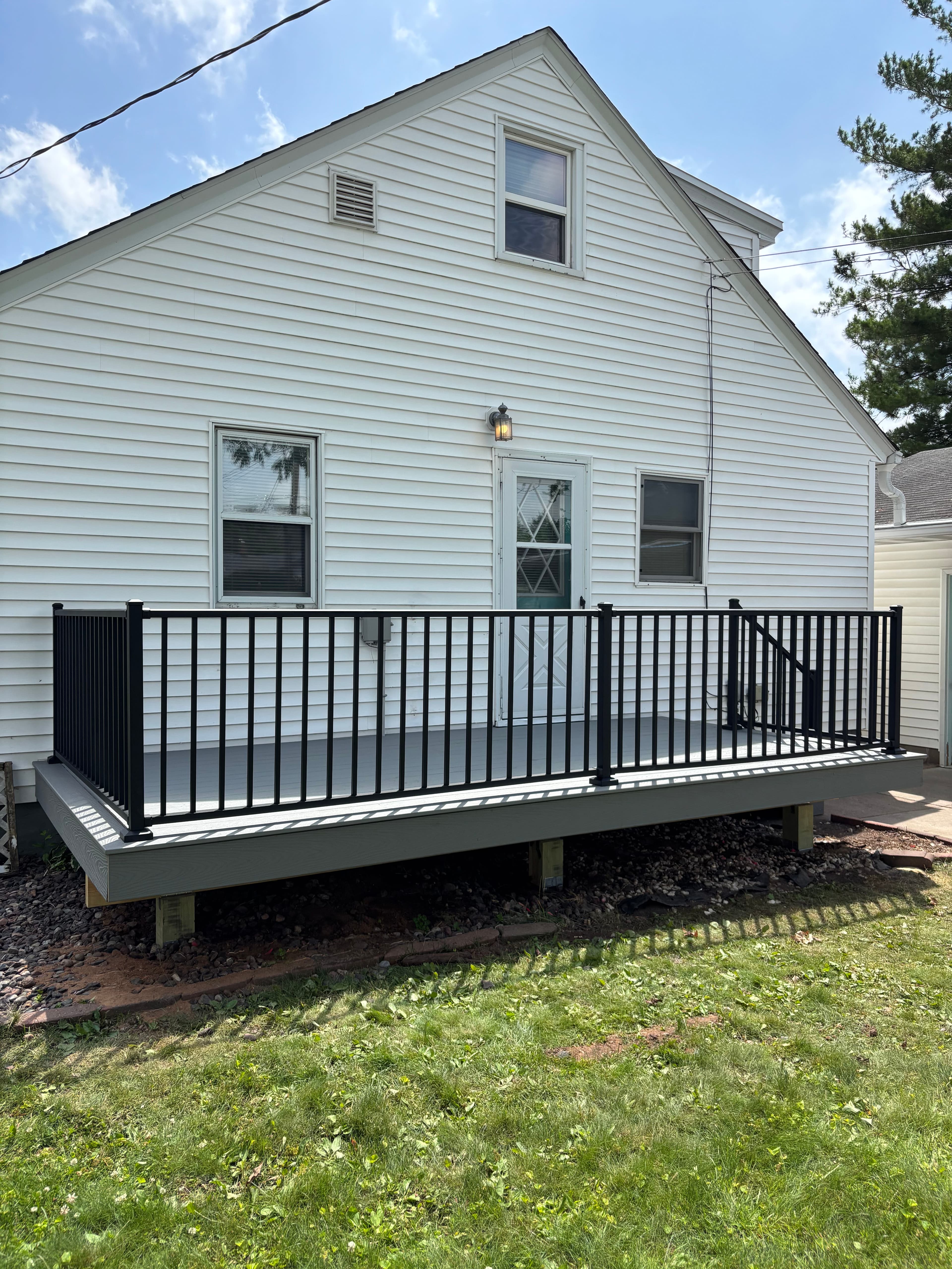 Project Low-Maintenance Trex Deck Build with Black Aluminum Railings image